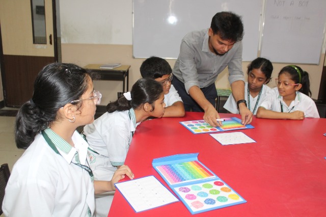 Instructor demonstrating concepts with visual learning tools